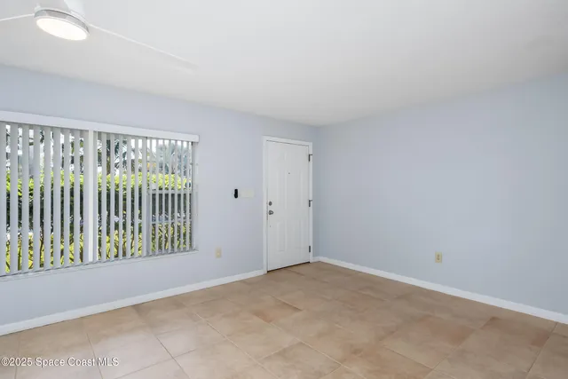 a kitchen with stainless steel appliances granite countertop a refrigerator a sink and a stove