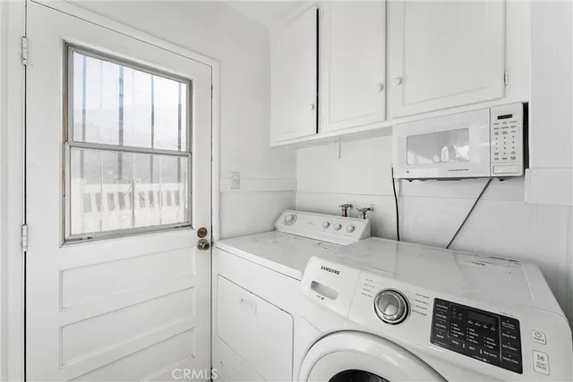 a bathroom with a sink and mirror with toilet