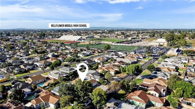 an aerial view of residential building with city view