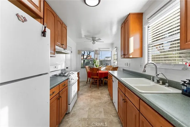 a kitchen that has a cabinets and a stove top oven