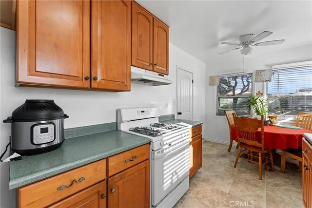 a spacious bathroom with a granite countertop sink and a window