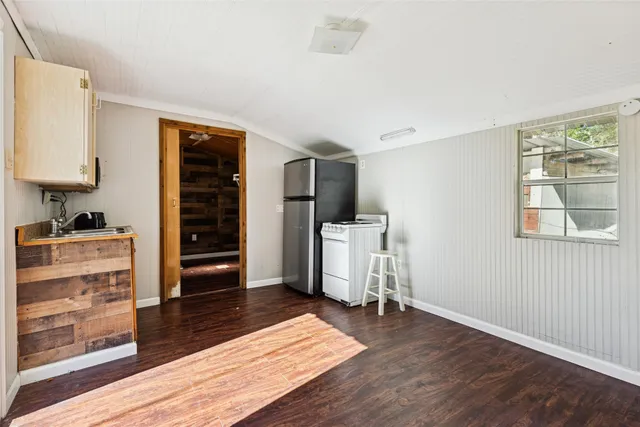 a room with furniture and wooden floor