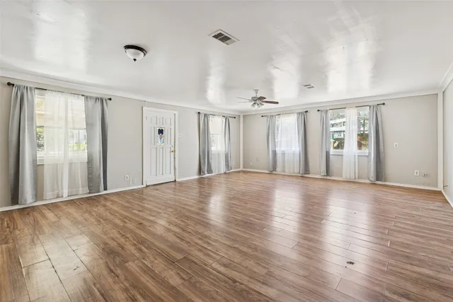 a view of a livingroom with wooden floor
