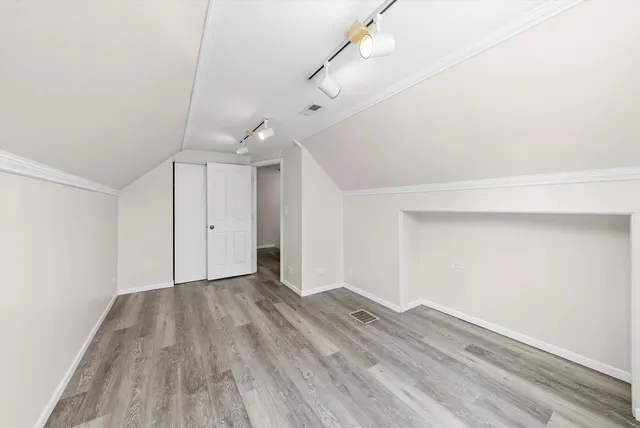 a bathroom with a sink mirror vanity and toilet