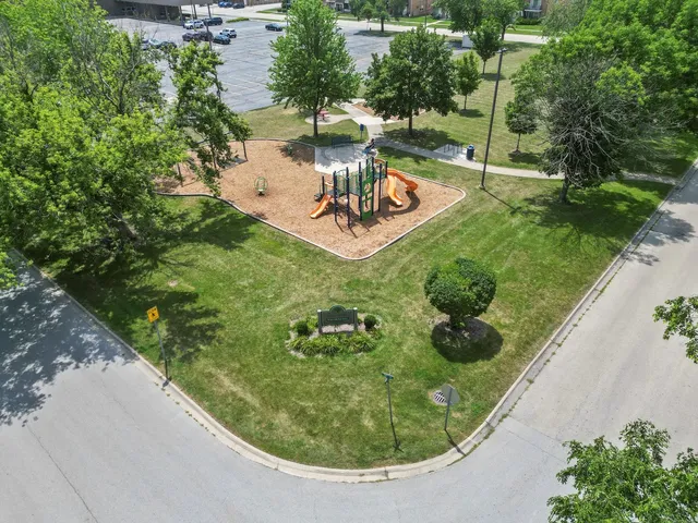 an aerial view of a house with a yard