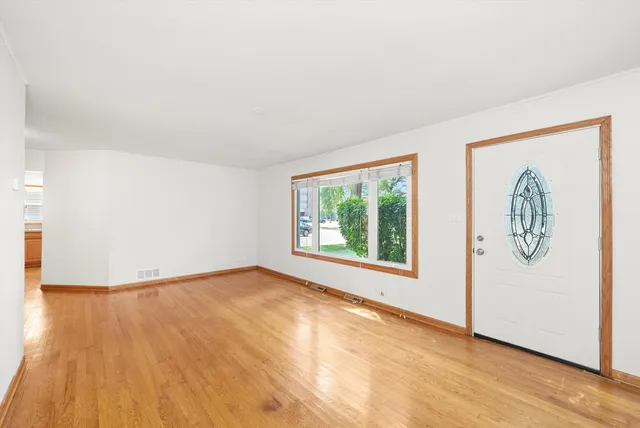 a view of an empty room and glass door