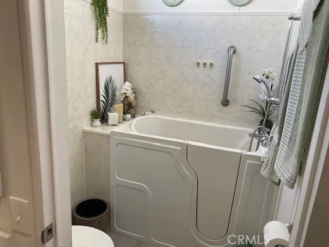 a bathroom with a shower and toilet