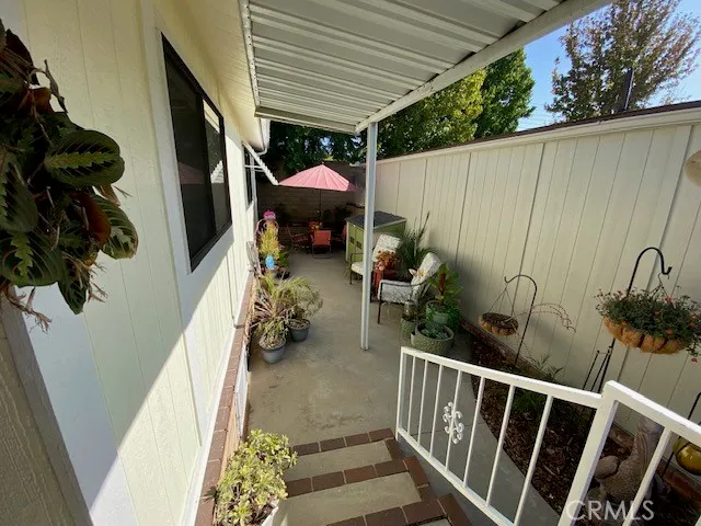 a view of a house with a flower garden