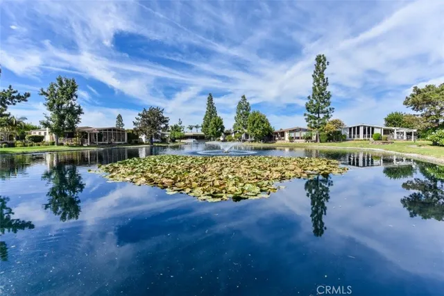 a kitchen with a sink a stove and cabinets