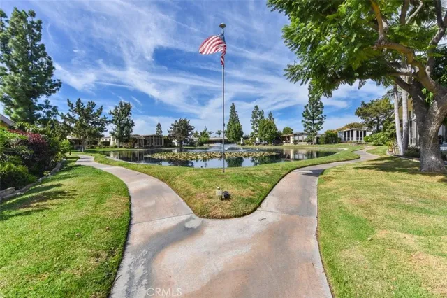 a living room with lots of furniture and a large window