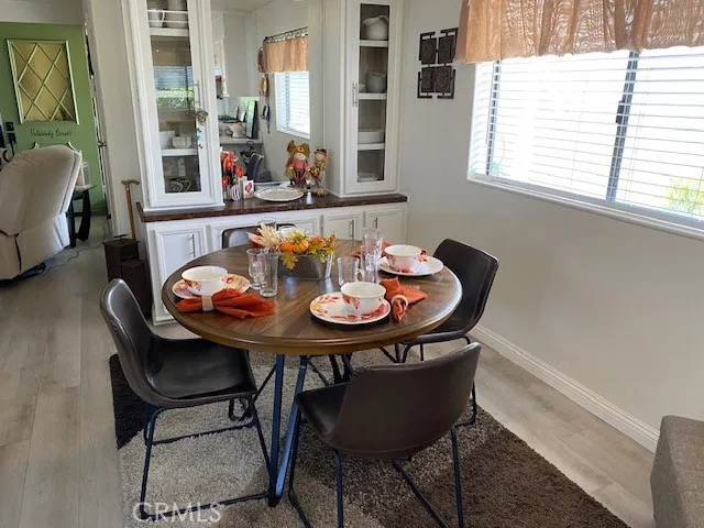 a view of a dining room with furniture and window