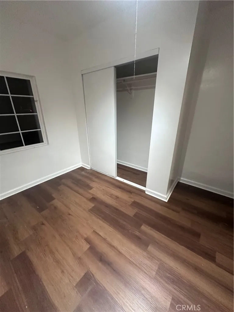 634 33rd Street Bakersfield, CA 93301 - Photo 14 of 39 a view of an empty room with wooden floor and cabinets