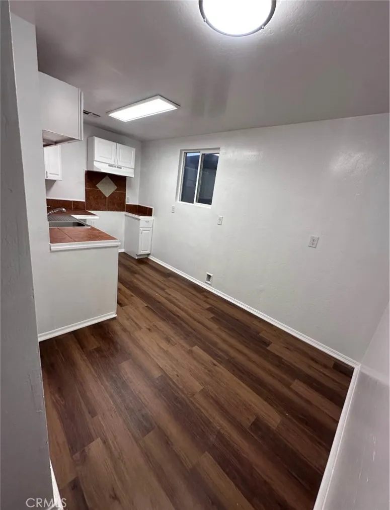 634 33rd Street Bakersfield, CA 93301 - Photo 17 of 39 a view of kitchen with wooden floor and electronic appliances
