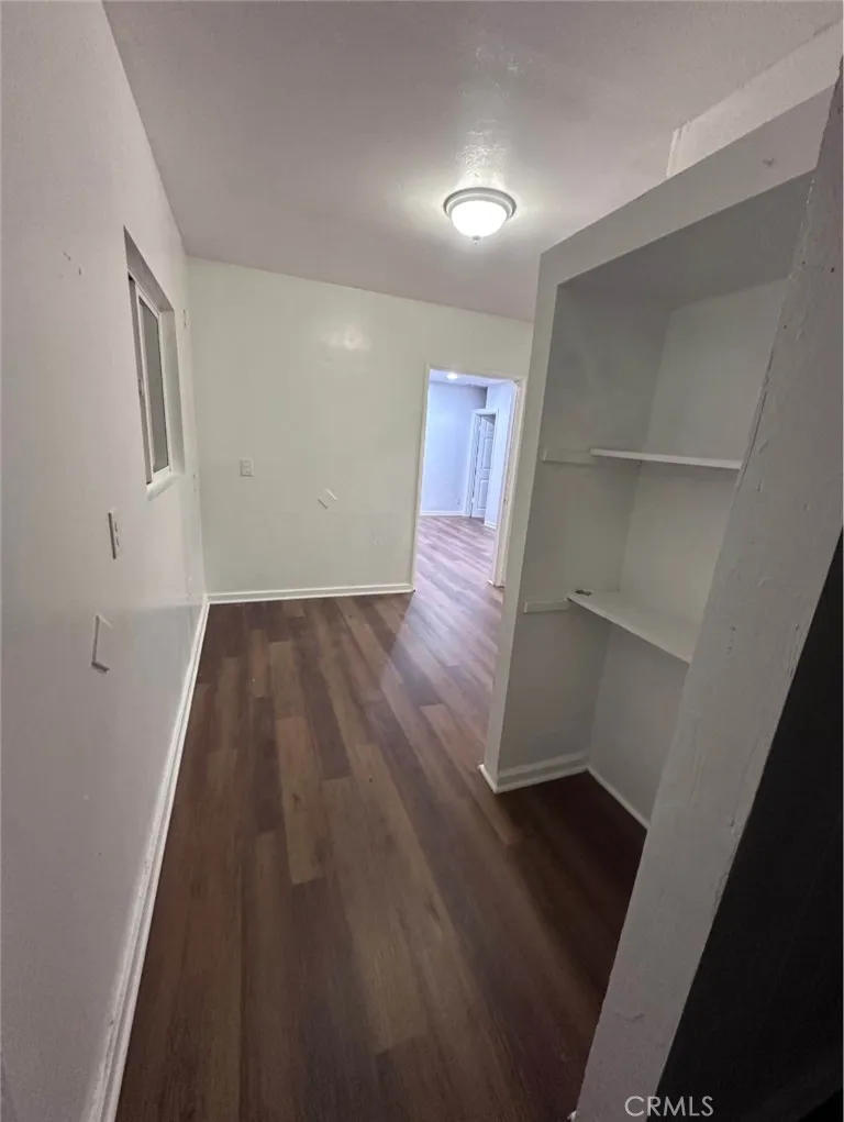 634 33rd Street Bakersfield, CA 93301 - Photo 24 of 39 an empty room with wooden floor and closet