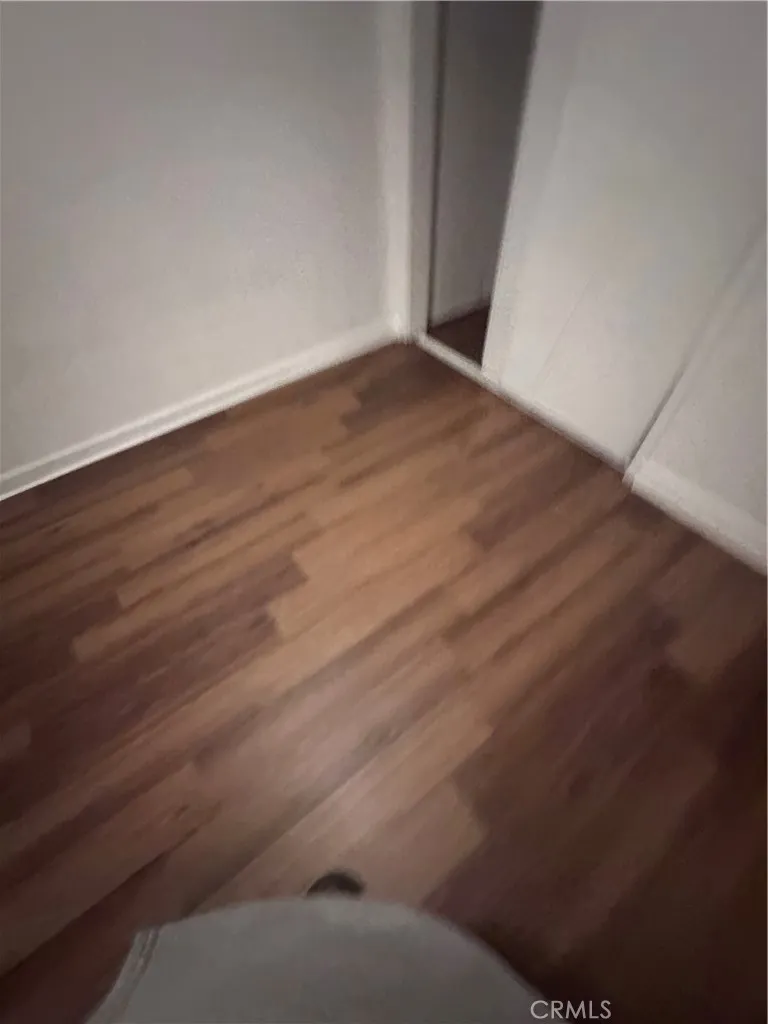 634 33rd Street Bakersfield, CA 93301 - Photo 5 of 39 a view of an empty room with wooden floor