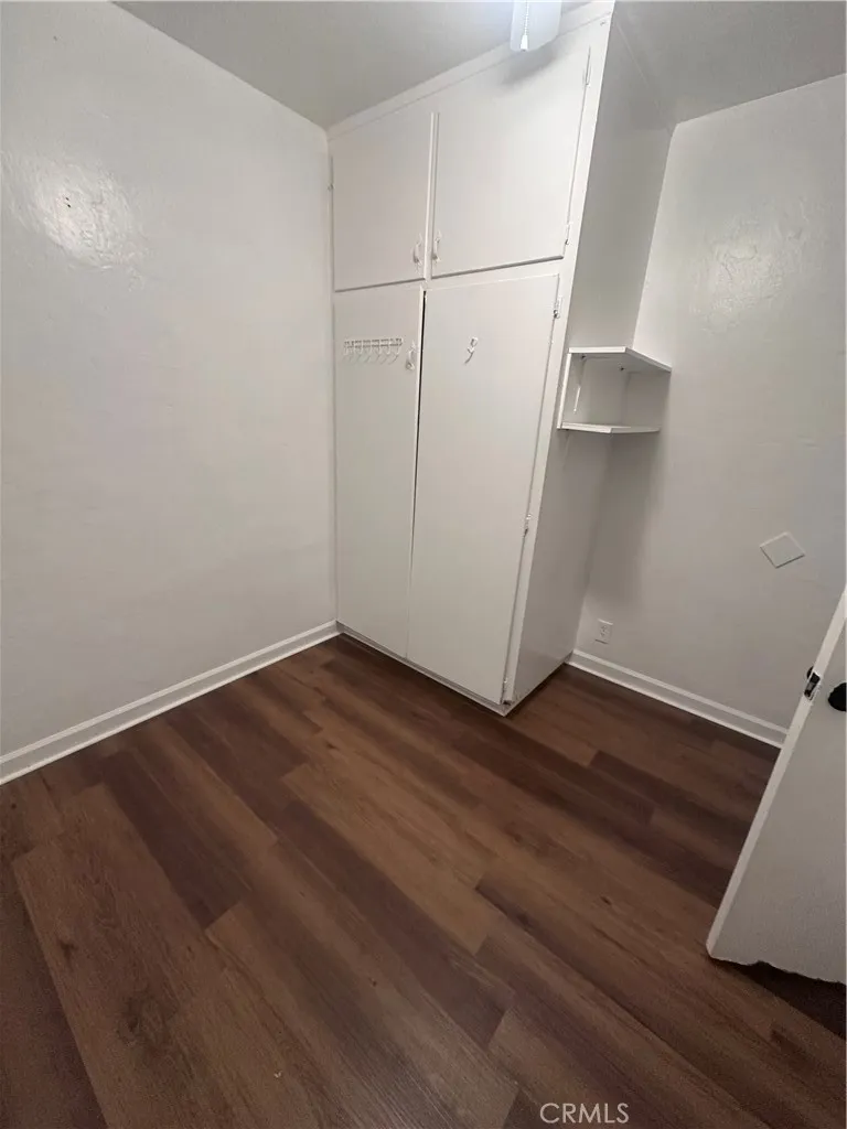 634 33rd Street Bakersfield, CA 93301 - Photo 8 of 39 an empty room with wooden floor