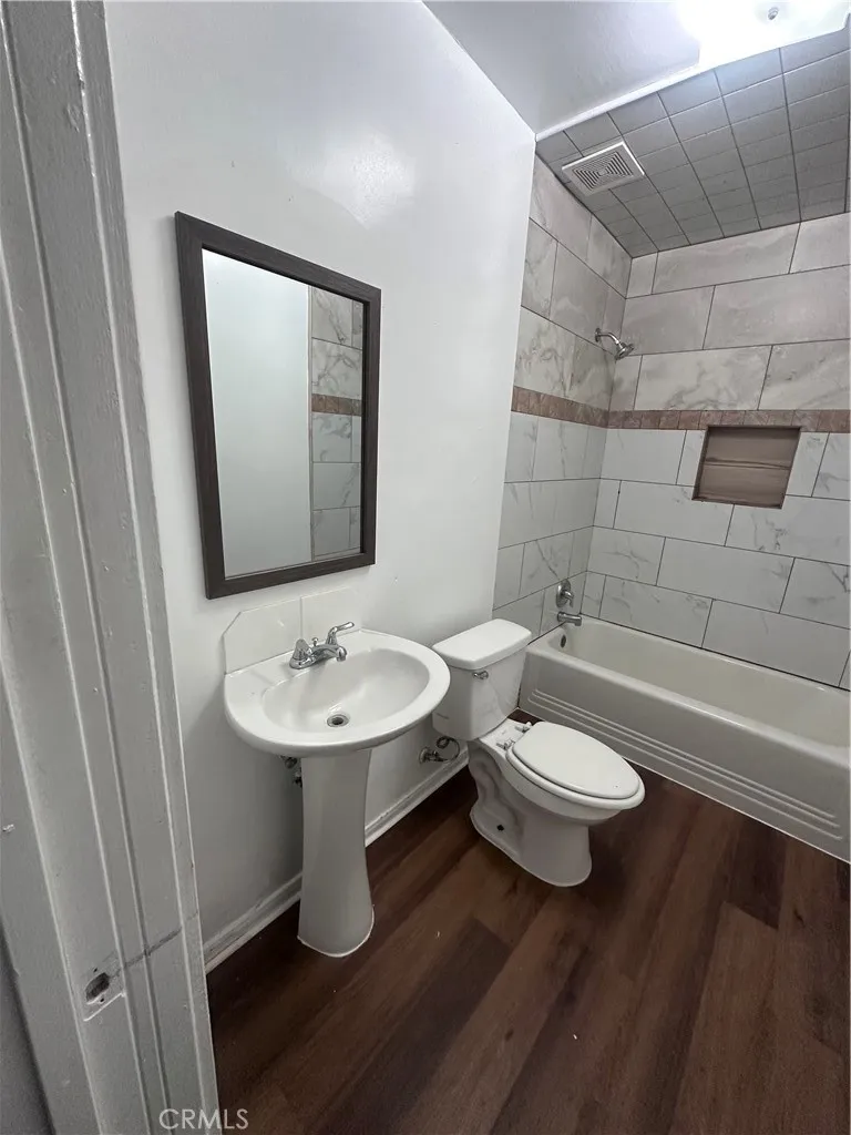 634 33rd Street Bakersfield, CA 93301 - Photo 10 of 39 a bathroom with a sink a toilet and shower