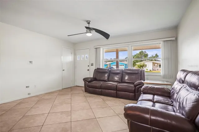 an empty room with wooden floor and closet area