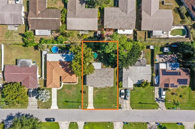 a front view of a house with yard and green space
