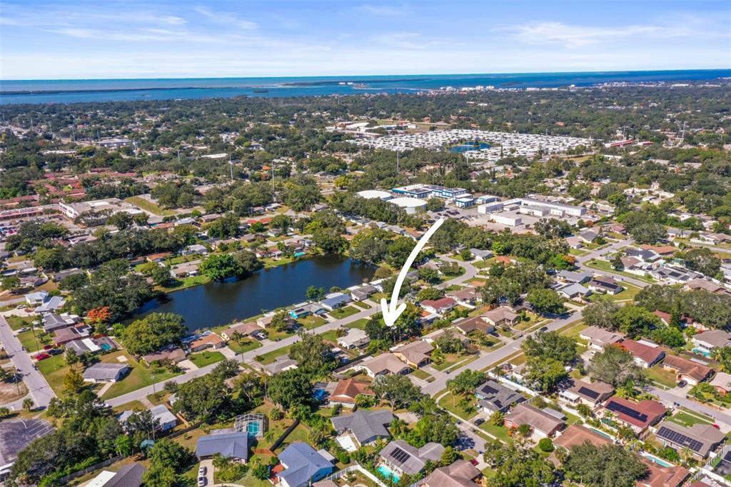 1215 Lazy Lake Road East Dunedin, FL 34698 - Photo 39 of 46 an aerial view of residential building with parking space