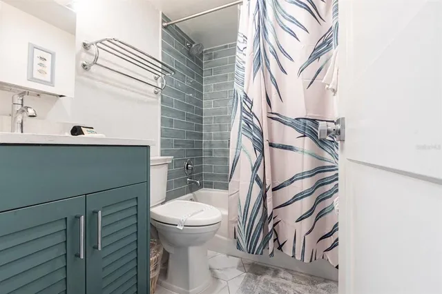 a bathroom with a sink and toilet