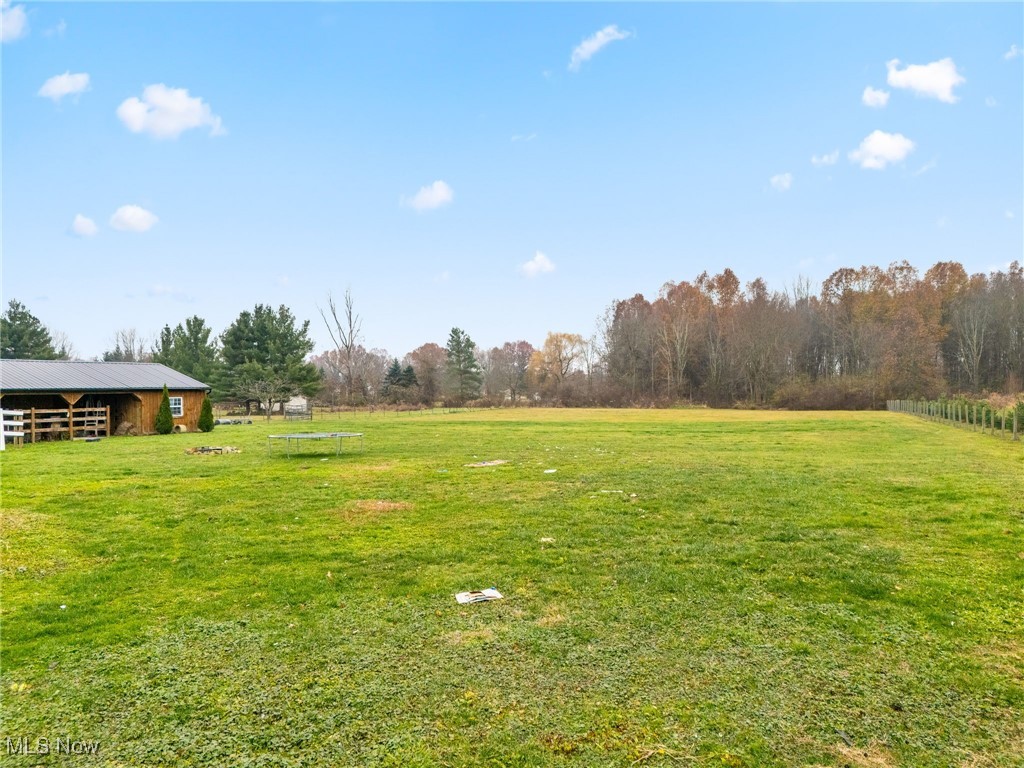 7374 Virginia Road Atwater, OH 44201 - Photo 46 of 49 View of green lawn with a view of rural / pastoral area and an outbuilding