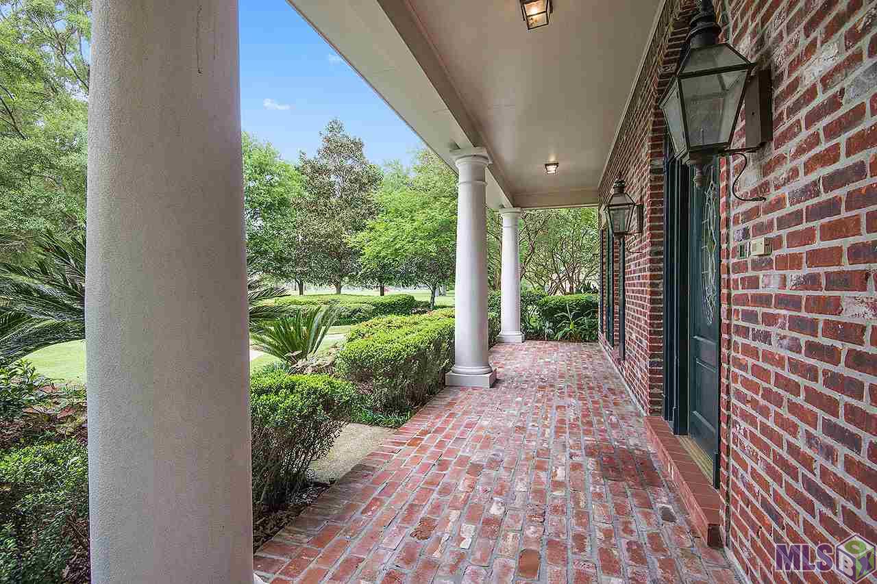 10355 South Tiger Bend Road Baton Rouge, LA 70817 - Photo 20 of 24 Brick floored front porch