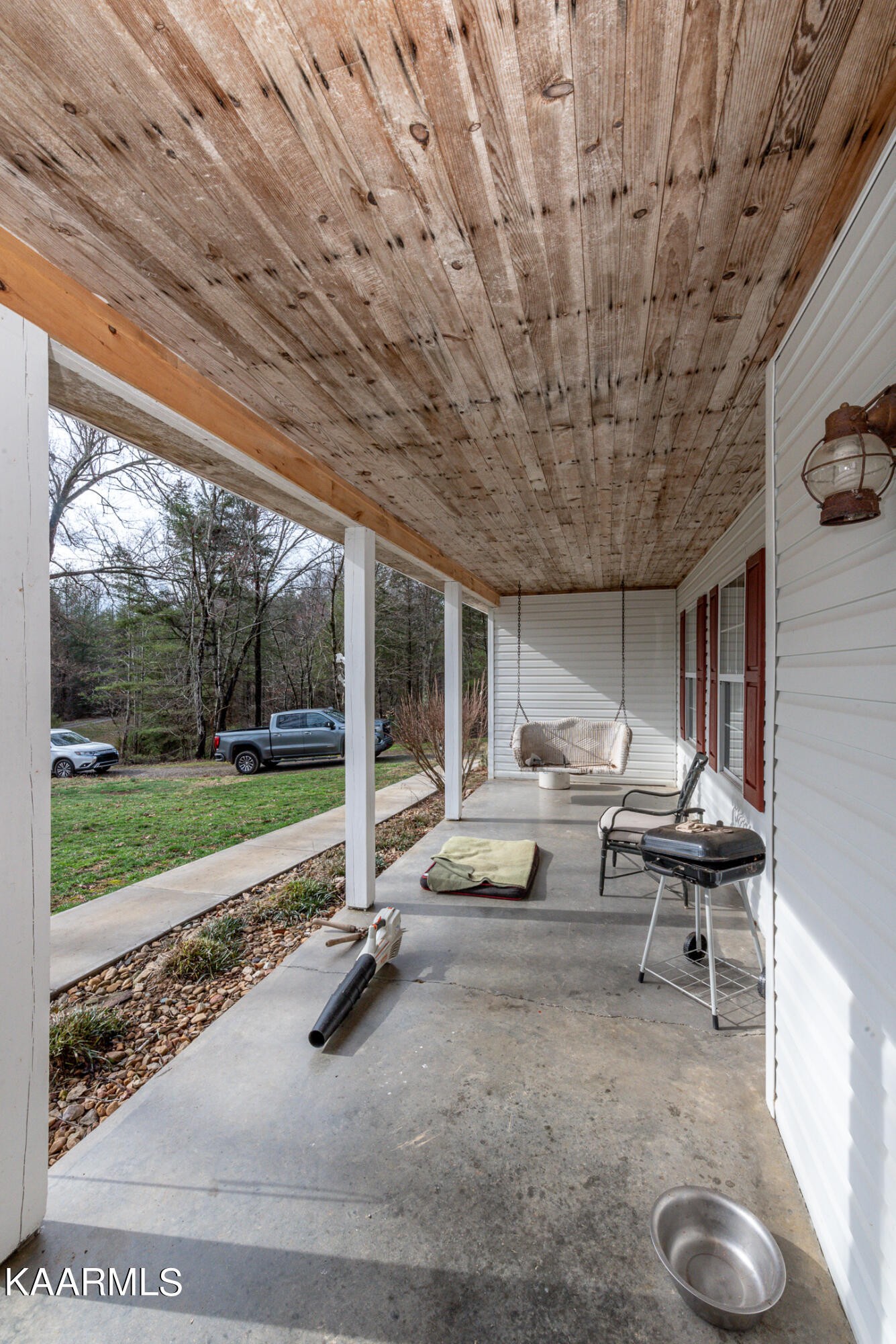 1620 Reliance Road Tellico Plains, TN 37385 - Photo 45 of 59 a view of a patio with chairs and floor to ceiling window
