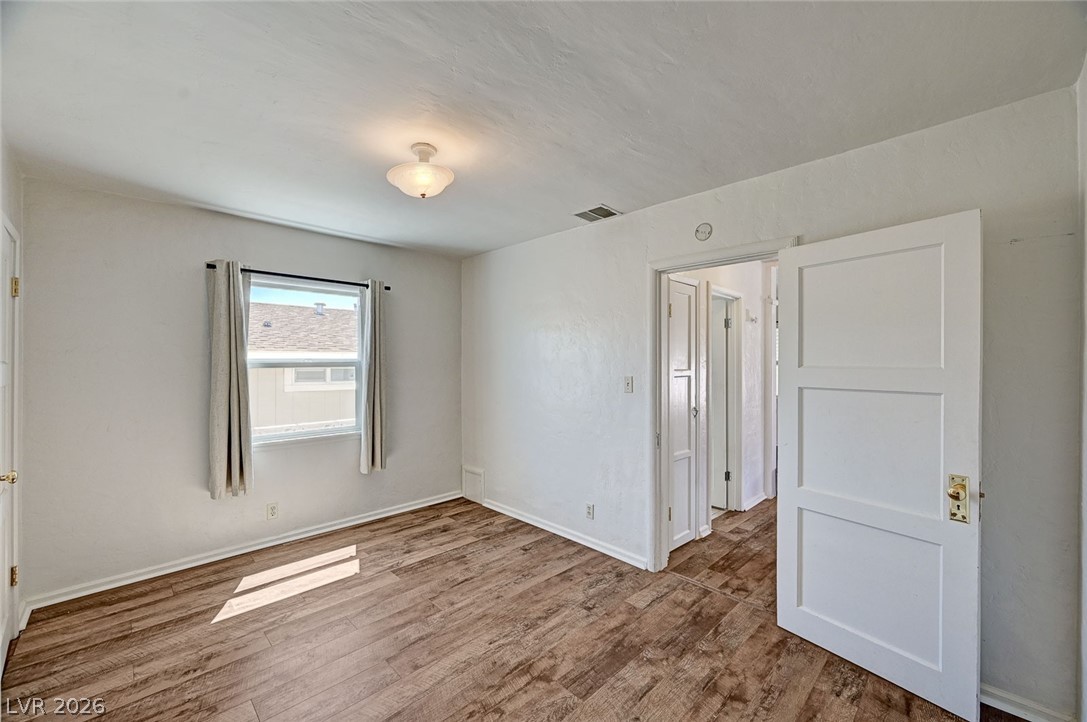 629 L Avenue Boulder City, NV 89005 - Photo 30 of 46 Spare room with wood finished floors and baseboards
