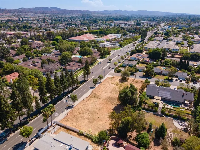 an aerial view of residential houses and outdoor space