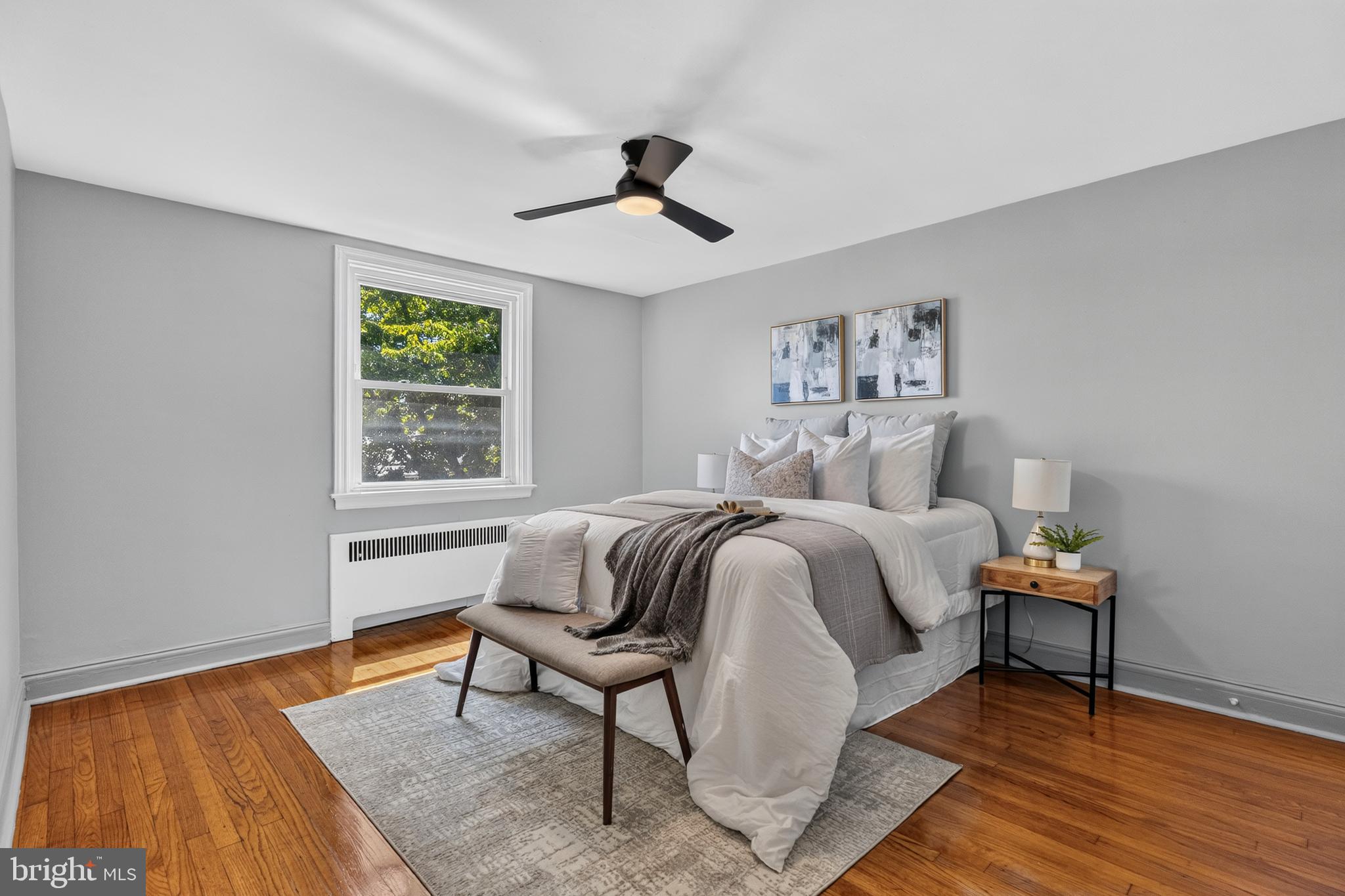 3906 Yolando Road Baltimore, MD 21218 - Photo 9 of 30 a bedroom with a bed and wooden floor