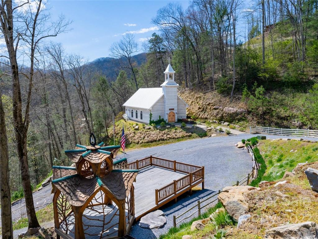 1610 Perth Road Clyde, NC 28721 - Photo 32 of 46 a view of a patio with table and chairs under an umbrella