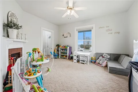 a bedroom with furniture and a rug
