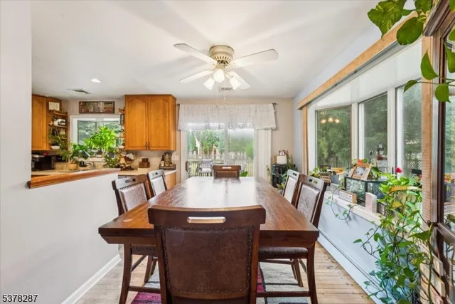 a view of a dining room with furniture window and outside view