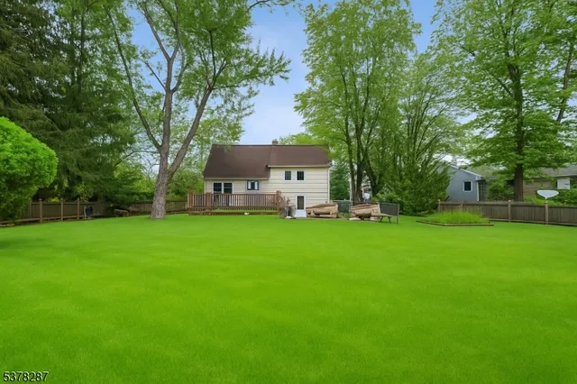 a view of a house with a backyard porch and sitting area