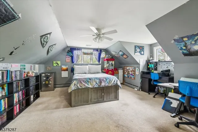 a living room with lots of furniture and baby walls