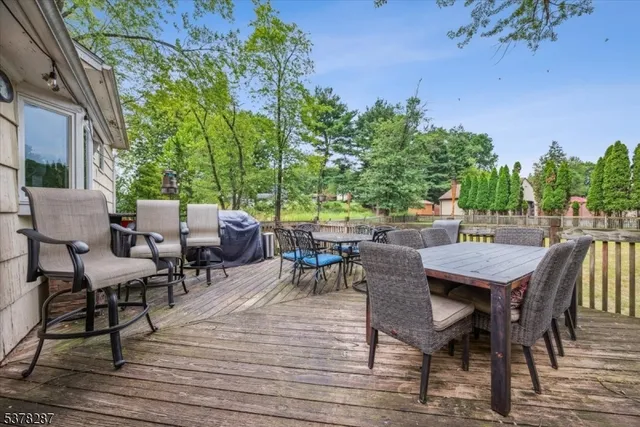 an outdoor space with furniture and wooden floor