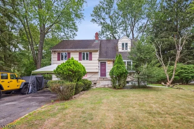 front view of a house with a garden