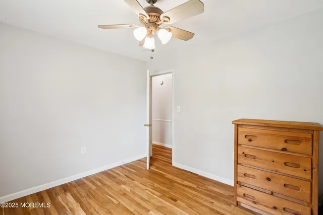 a view of room with window and ceiling fan