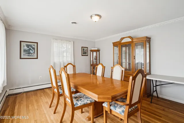 a view of a dining room with furniture and window