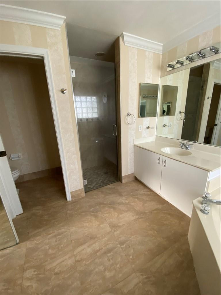22911 Royal Crown Terrace Boca Raton, FL 33433 - Photo 15 of 18 a view of a bathroom with bathtub and shower