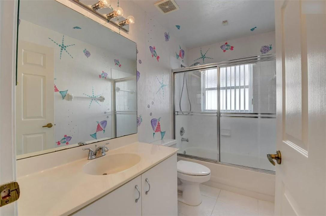 22911 Royal Crown Terrace Boca Raton, FL 33433 - Photo 6 of 18 a bathroom with a sink a toilet and shower