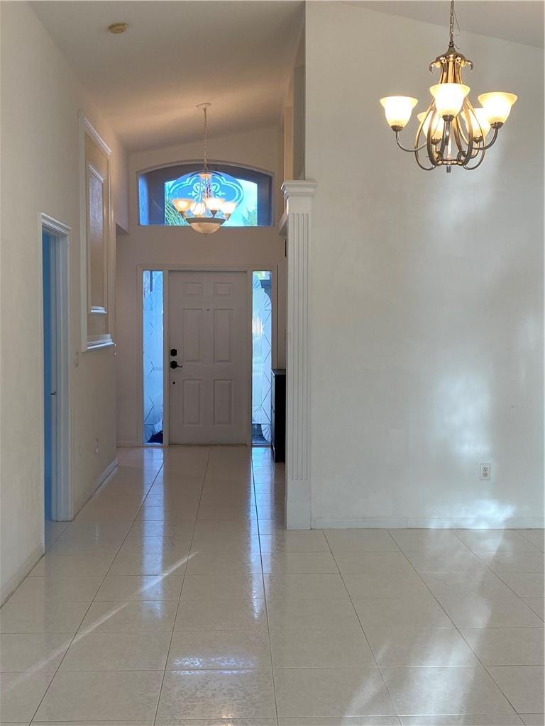 22911 Royal Crown Terrace Boca Raton, FL 33433 - Photo 8 of 18 wooden floor in an empty room with a window