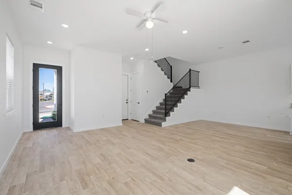 a kitchen with stainless steel appliances granite countertop a sink stove microwave and refrigerator
