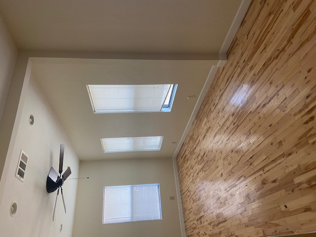 1034 Magnolia Street Lockhart, TX 78644 - Photo 11 of 12 Unfurnished room featuring light wood-style flooring, a ceiling fan, and recessed lighting