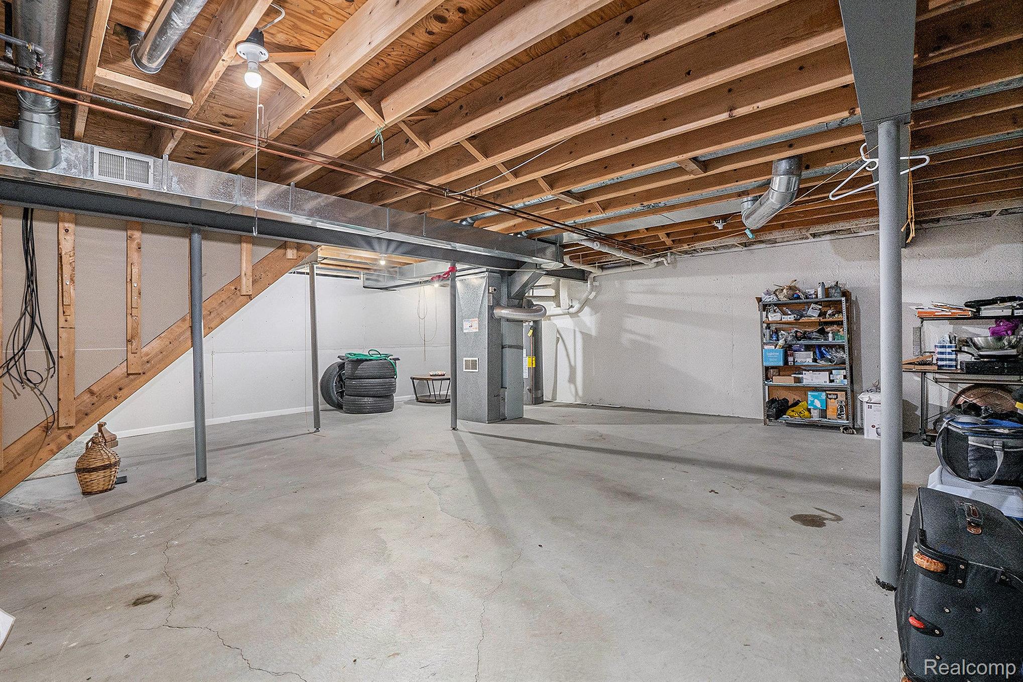 5477 Victory Circle Sterling Heights, MI 48310 - Photo 27 of 32 Unfinished basement with concrete flooring and exposed ceiling joists