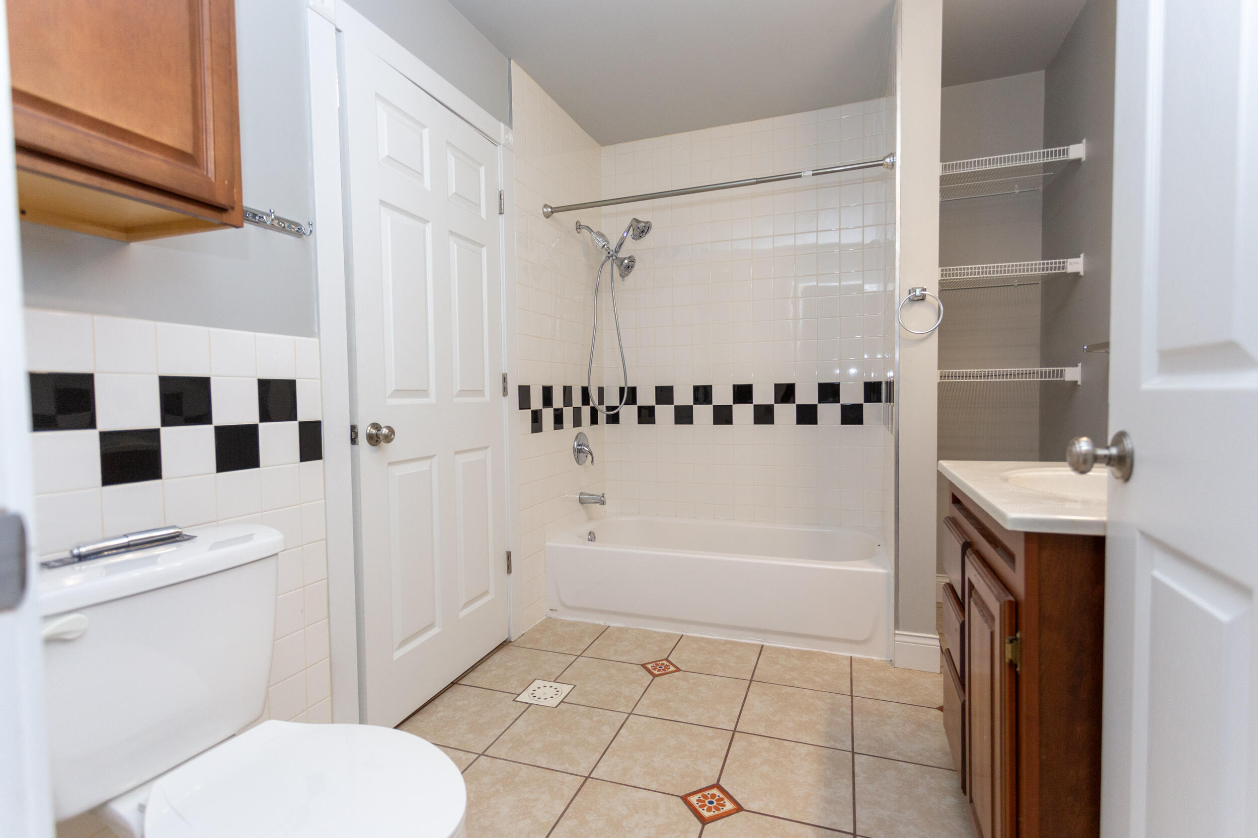 525 Franklin Street, Unit 7 Michigan City, IN 46360 - Photo 13 of 14 a bathroom with a granite countertop sink toilet and shower