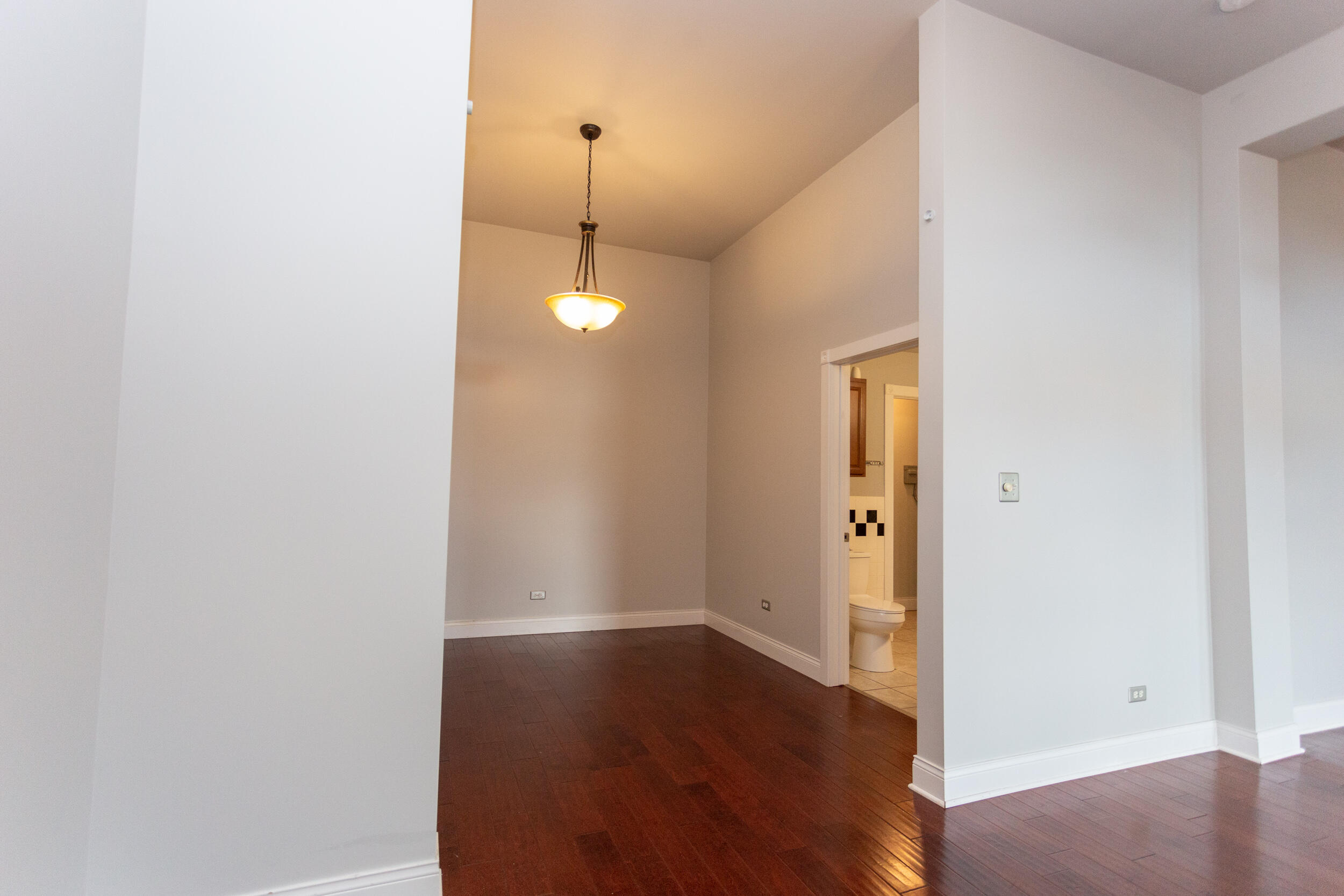 525 Franklin Street, Unit 7 Michigan City, IN 46360 - Photo 8 of 14 a view of an empty room with wooden floor