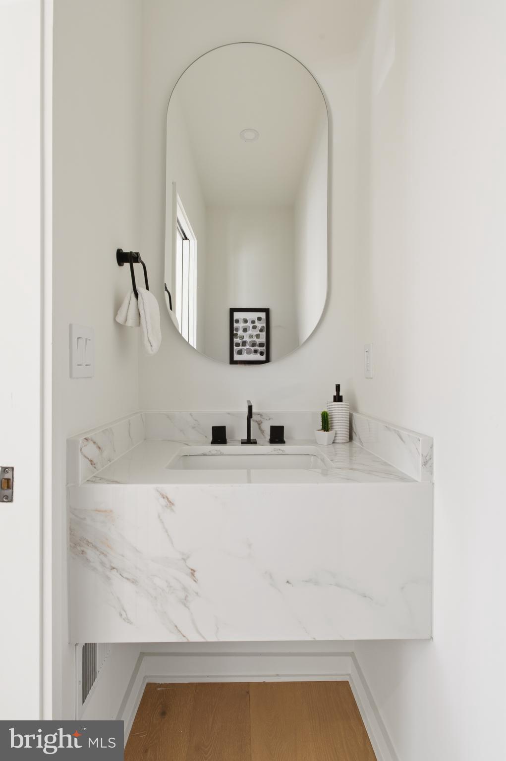 3554 T Street Northwest Washington, DC 20007 - Photo 21 of 57 a bathroom with a sink and a mirror