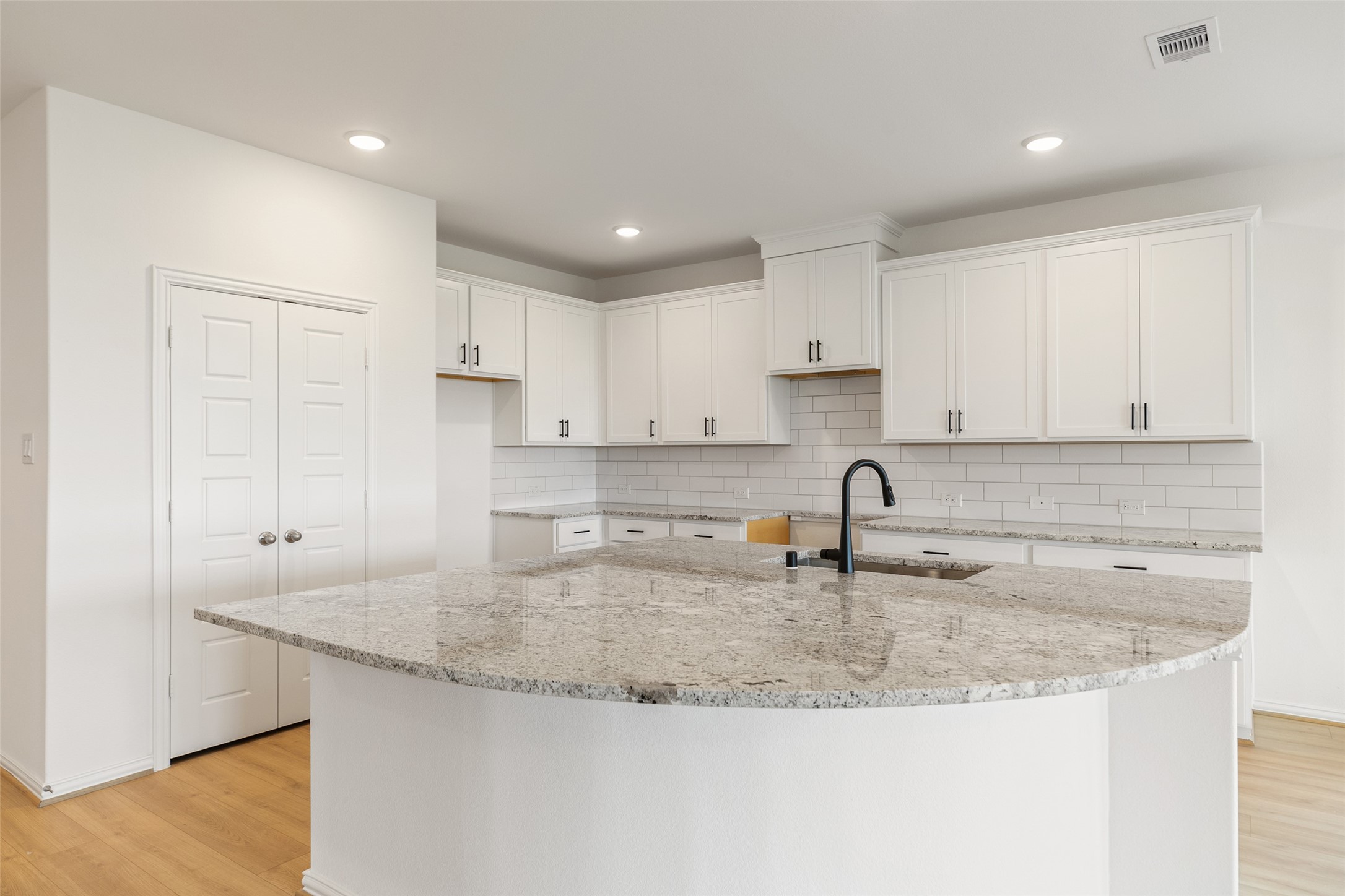 2805 Ruby Laurel Drive Iowa Colony, TX 77583 - Photo 11 of 39 a kitchen with granite countertop a sink a stove and a refrigerator